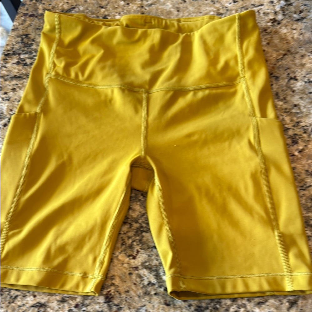 Athleta Ultimate Stash pocket  7” Yellow Bike Shorts High Waist Stretch